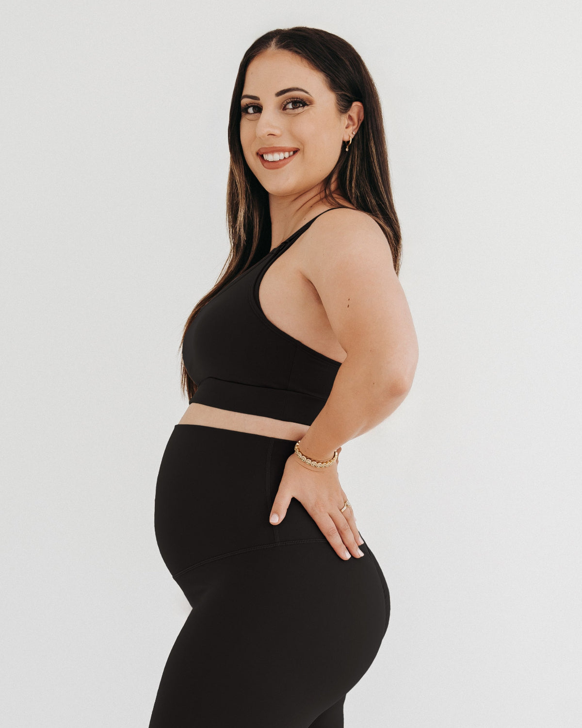 Black AXK high-impact, racerback, maternity and nursing sports bra with one-handed clip access. Premium maternity athletic and activewear by AXK, offered in plus size maternity, tall friendly, and petite maternity sizing.
